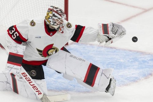 Ottawa Senators' goaltender Linus Ullmark (35) tips a Toronto Maple Leafs shot with his glove during third period NHL playoff action in Toronto on Sunday, April 20, 2025. THE CANADIAN PRESS/Nick Iwanyshyn