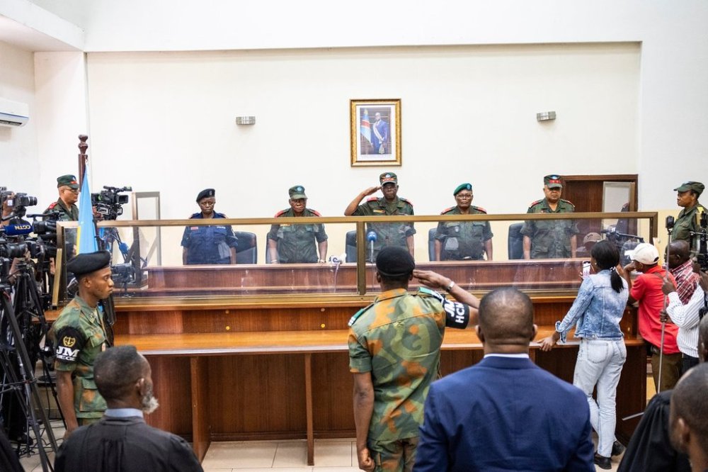 Military officers stand in the dock during the trial of former Congolese President Joseph Kabila in Kinshasa, Democratic Republic of Congo, Tuesday, Sept. 30, 2025 (AP Photo/ Samy Ntumba Shambuyi)