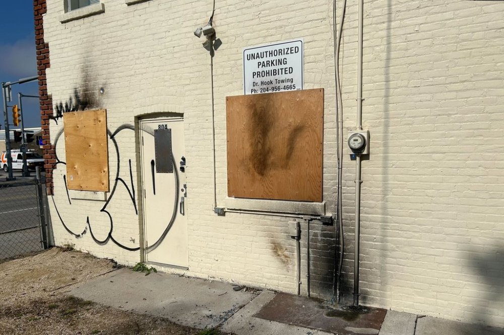 Scorch marks are seen on the rear exterior of the constituency office of Manitoba cabinet minister Bernadette Smith, in Winnipeg, Tuesday, Sept. 23, 2025. THE CANADIAN PRESS/Steve Lambert
