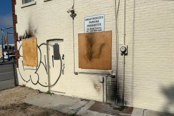 Scorch marks are seen on the rear exterior of the constituency office of Manitoba cabinet minister Bernadette Smith, in Winnipeg, Tuesday, Sept. 23, 2025. THE CANADIAN PRESS/Steve Lambert