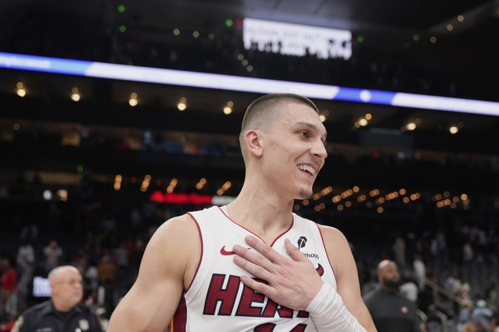 FILE - Miami Heat guard Tyler Herro (14) reacts to a win over the Atlanta Hawks in an NBA play-in tournament basketball, Friday, April 18, 2025, in Atlanta. (AP Photo/Brynn Anderson, File)