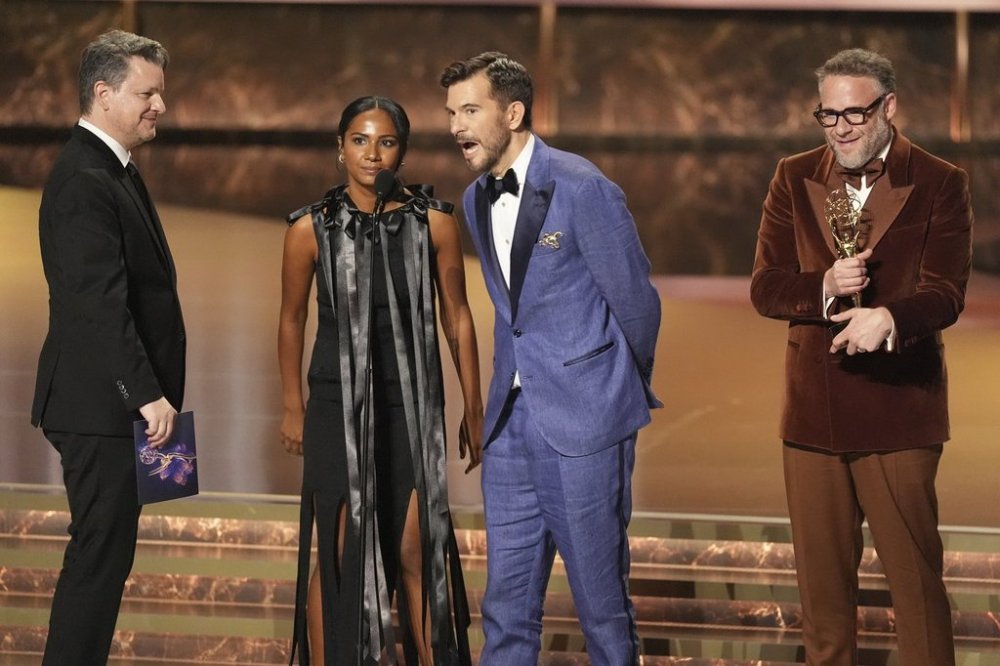 Alex Gregory, from left Frida Perez, Peter Huyck, and Seth Rogen, and accept the award for outstanding writing for a comedy series for