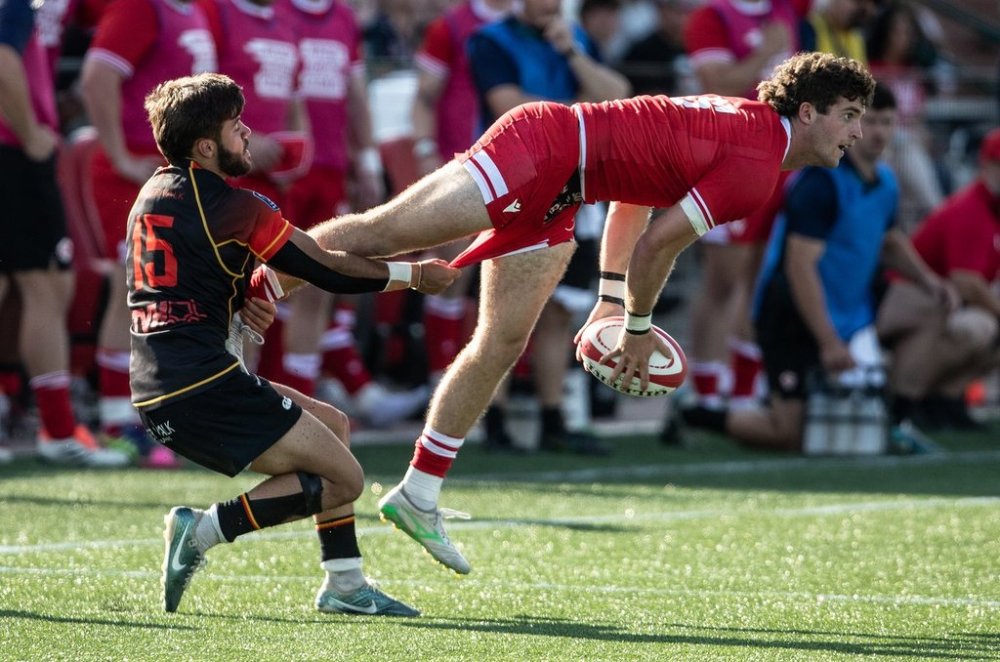 Canada's Brenden Black (right) is tackled by Belgium's Simeon Soenen (15) during second half men's rugby action in Edmonton, on Saturday, July 12, 2025. THE CANADIAN PRESS/Jason Franson