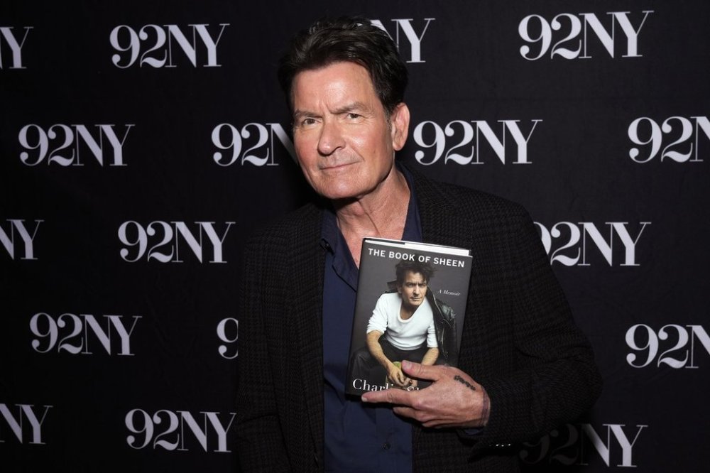 Charlie Sheen poses backstage before discussing his book