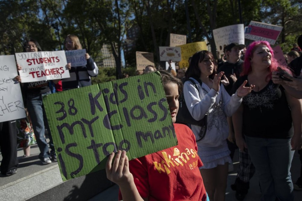 Students walk out of school to join a protest in support of pay for teachers and funding for schools at the Alberta Legislature in Edmonton on Monday, Sept. 22, 2025. THE CANADIAN PRESS/Amber Bracken