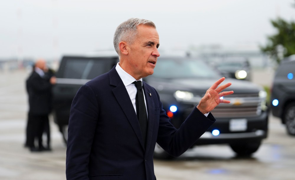 Prime Minister Mark Carney talks to reporters on the tarmac Thursday before he departs Ottawa to travel to the United Kingdom. Nishtha Gupta writes that Carney's move to make artificial intelligence a priority file for the government is a shift