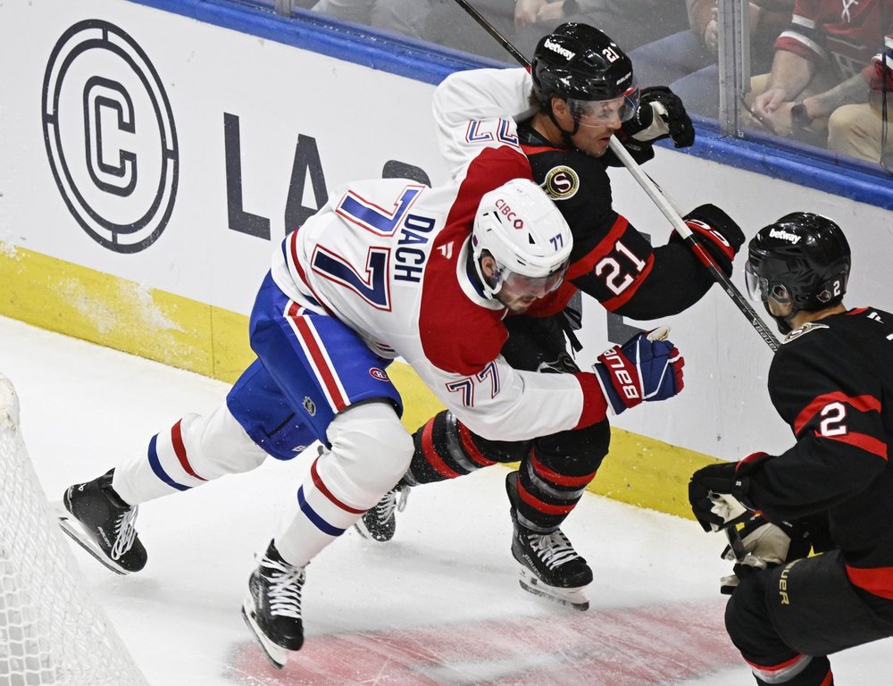 Montreal Canadiens' Kirby Dach checks Ottawa Senators' Nick Cousins during first period NHL preseason action in Quebec City, Tuesday, September 30, 2025. THE CANADIAN PRESS/Jacques Boissinot
