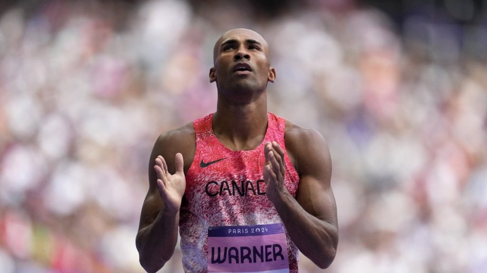 Damian Warner, of Canada, reacts after finishing his decathlon 110 meters hurdle heat at the 2024 Summer Olympics, Saturday, Aug. 3, 2024, in Saint-Denis, France. (AP Photo/Ashley Landis)