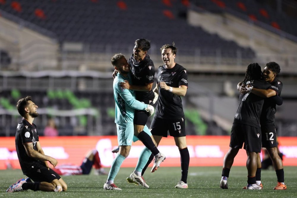 Vancouver FC players celebrate with goalkeeper/captain Callum Irving, second left, after defeating Atletico Ottawa 3-2 on aggregate in their Canadian Championship semifinal at TD Place in Ottawa in this Thursday, Sept. 18, 2025 handout photo. THE CANADIAN PRESS/HO, Canadian Premier League, Thiago Szwarc