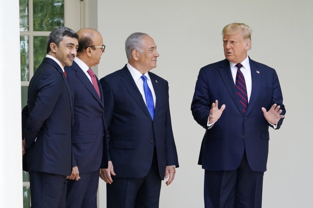 FILE - President Donald Trump, far right, walks to the Abraham Accords signing ceremony, from left, United Arab Emirates Foreign Minister Abdullah bin Zayed Al Nahyan, Bahrain Foreign Minister Khalid bin Ahmed Al Khalifa and Israeli Prime Minister Benjamin Netanyahu at the White House on Sept. 15, 2020, in Washington. (AP Photo/Alex Brandon, File)