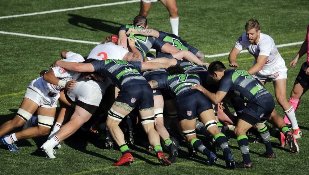 Seattle Seawolves, right, and San Diego Legion players square off in a scrum Sunday, April 22, 2018, in the first half of the first ever Major League Rugby (MLR) match in the Pacific Northwest in Tukwila, Wash. MLR, which began the inaugural season a day earlier, has seven teams across the United States and will run their regular season through June. (AP Photo/Elaine Thompson)