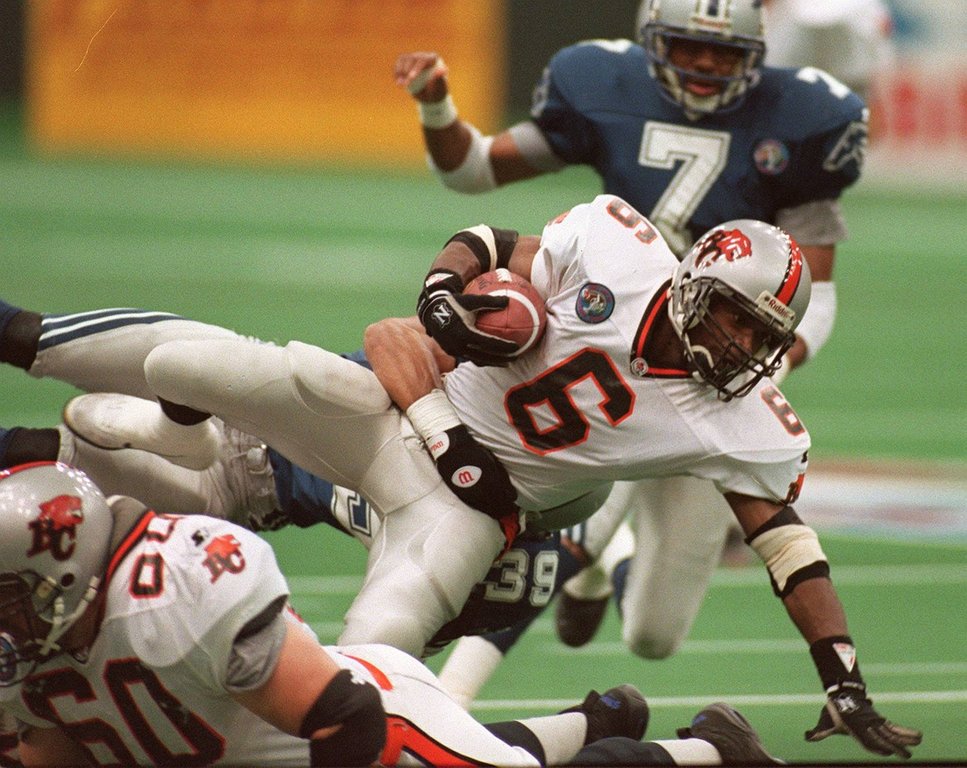 Grey Cup - BC Lions Cory Philpot is taken down by Baltimore 's Matt Goodwin. (Stf-Dave Buston)