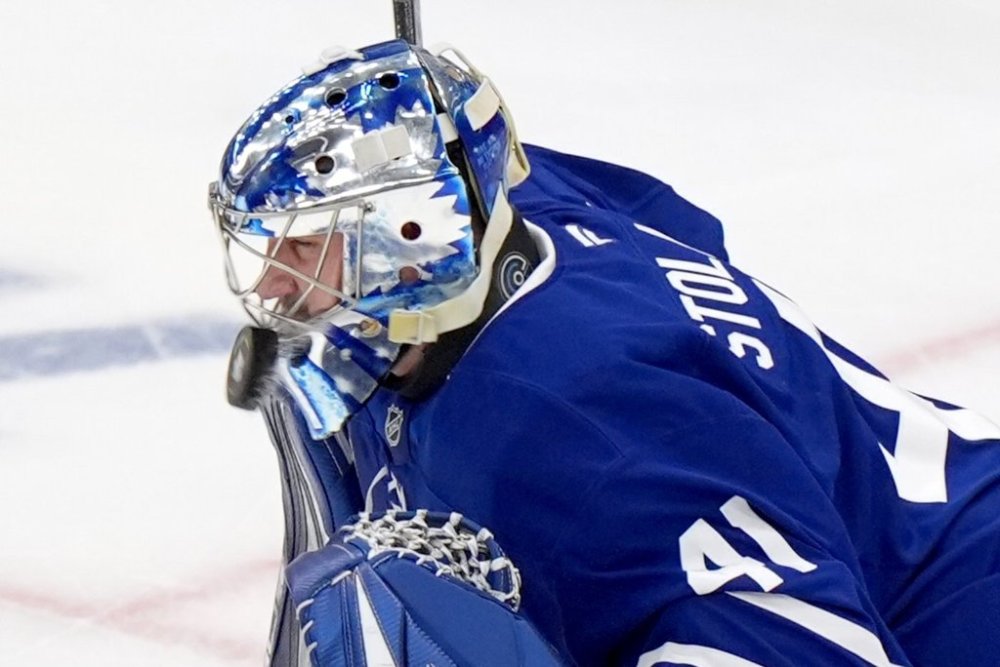 Toronto Maple Leafs goaltender Anthony Stolarz (41) takes a slap shot off the mask during first period, round two, game one NHL Stanley Cup playoff hockey action against the Florida Panthers in Toronto on Monday, May 5, 2025. THE CANADIAN PRESS/Frank Gunn