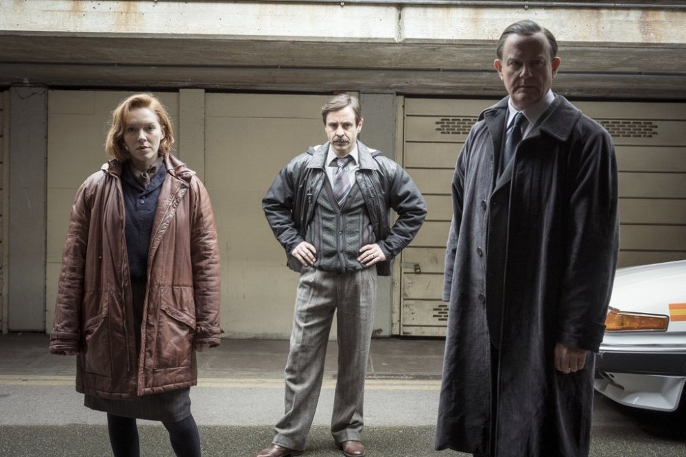 This image released by PBS Masterpiece shows Charlotte Spencer, from left, Emun Elliott, and Hugh Bonneville in a scene from