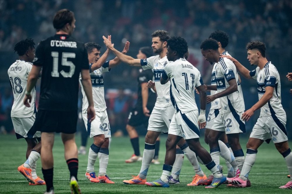 Vancouver Whitecaps' Thomas Muller (13) celebrates his goal against Vancouver FC with teammates during the first half of the Canadian Championship final soccer match, in Vancouver, on Wednesday, October 1, 2025. THE CANADIAN PRESS/Ethan Cairns