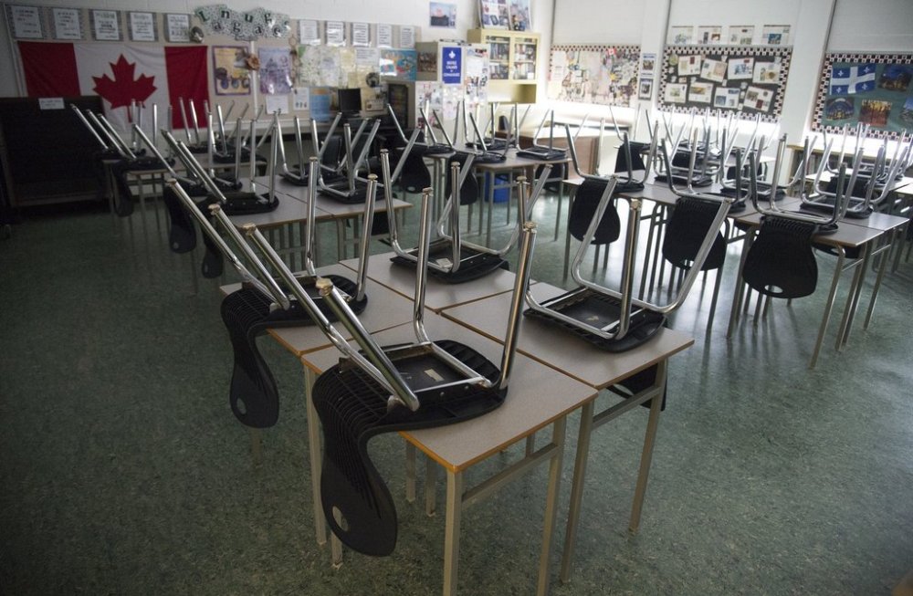 An empty classroom is pictured at Eric Hamber Secondary school in Vancouver, B.C. Monday, March 23, 2020. THE CANADIAN PRESS/Jonathan Hayward