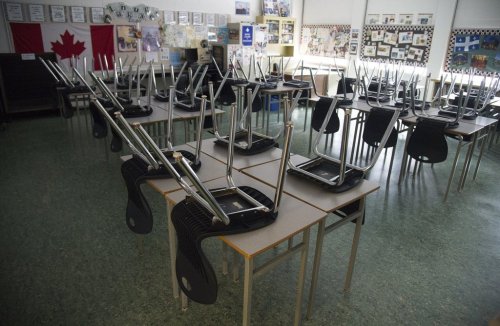 An empty classroom is pictured at Eric Hamber Secondary school in Vancouver, B.C. Monday, March 23, 2020. THE CANADIAN PRESS/Jonathan Hayward