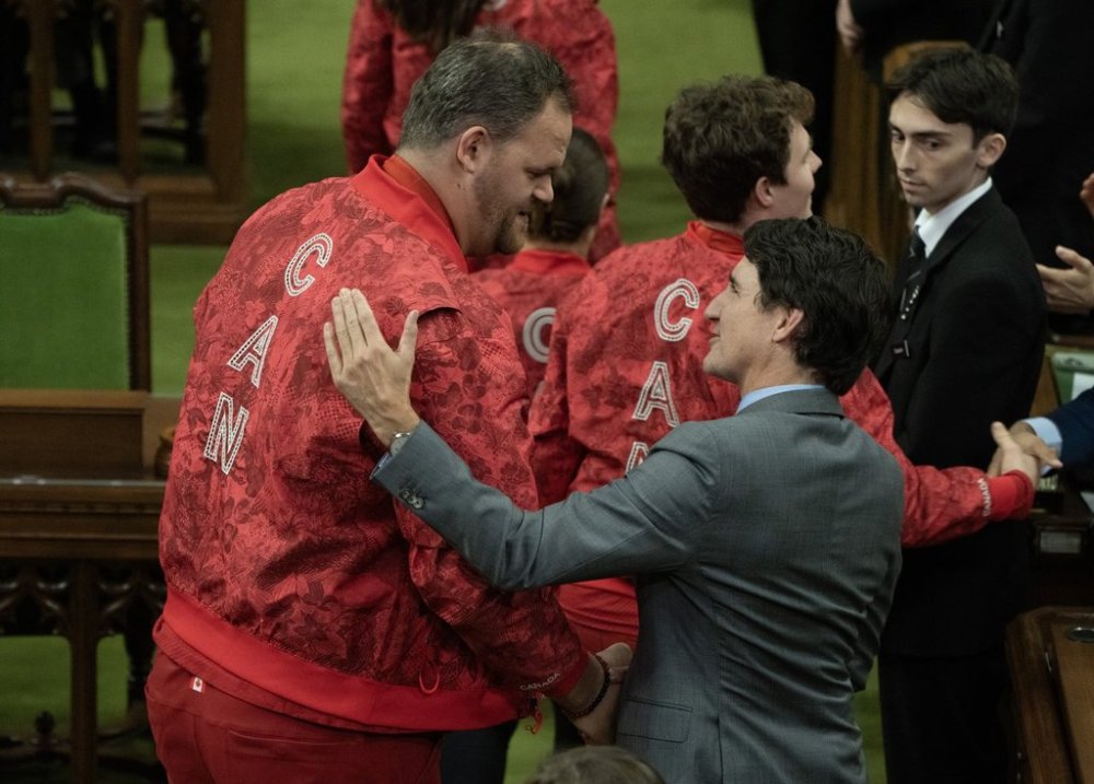 Two-time defending gold medallist Paralympic shot putter Greg Stewart meets Prime Minister Justin Trudeau as athletes who competed for Canada at the 2024 Paris Olympics and Paralympic Games are recognized at a ceremony in the House of Commons, in Ottawa, Wednesday, Dec. 4, 2024. THE CANADIAN PRESS/Adrian Wyld