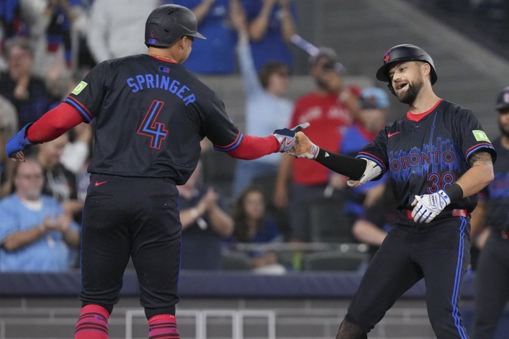 Blue Jays outfielder Nathan Lukes (right) celebrates with teammate George Springer after hitting a two-run homer in the fifth inning of a Major League Baseball game in Toronto on Sept. 26, 2025. THE CANADIAN PRESS/Chris Young