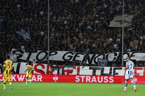 PAOK's fans display a banner that reads 