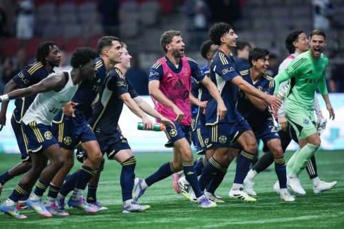 Vancouver Whitecaps' Thomas Muller, centre, Rayan Elloumi, third right, Mathias Laborda, second right, goalkeeper Isaac Boehmer, back right, and their teammates celebrate after defeating Forge FC 4-0 during a Canadian Championship semifinal soccer match, in Vancouver, on Tuesday, Sept. 16, 2025. THE CANADIAN PRESS/Darryl Dyck