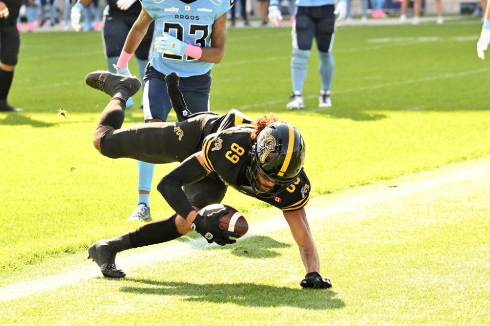 Hamilton Tiger-Cats wide receiver Kenny Lawler (89) scores a touchdown against the Toronto Argonauts during first half CFL football action in Toronto, Saturday, Oct. 4, 2025. THE CANADIAN PRESS/Jon Blacker