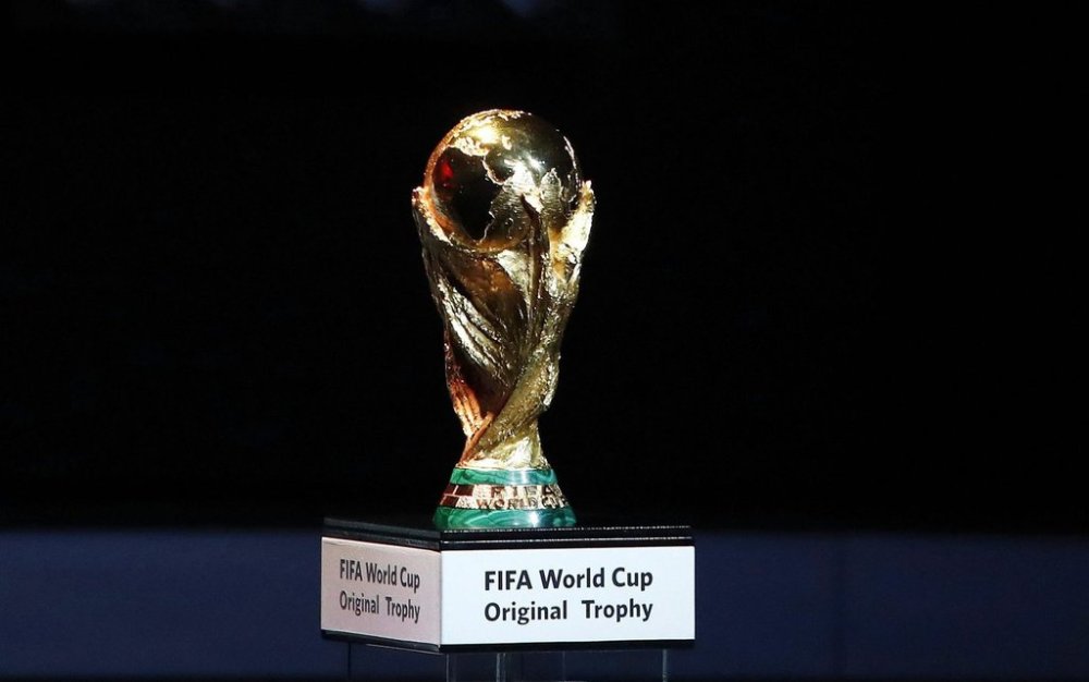 FILE - A Friday Dec. 1, 2017 file photo of the World Cup trophy placed on display during the 2018 soccer World Cup draw in the Kremlin in Moscow. Morocco has touted its limited threat from gun crime in a 2026 World Cup bidding proposal to take on the United States-led rival for the 2026 soccer showpiece. The North African nation highlights safety for visiting fans in bidding documents published by FIFA on Monday that do however show every stadium and training ground requires building work. (AP Photo/Pavel Golovkin, File)