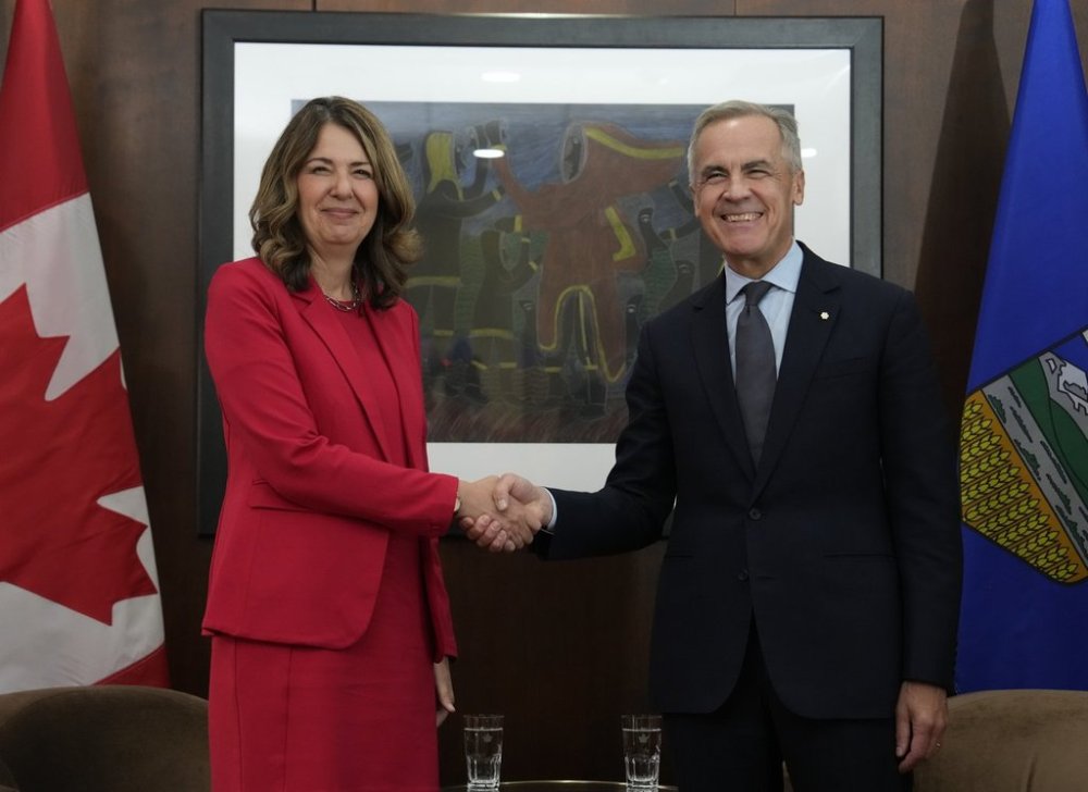 Prime Minister Mark Carney is seen with Alberta Premier Danielle Smith at the start of a meeting in Ottawa, Monday, Oct. 6, 2025. THE CANADIAN PRESS/Adrian Wyld