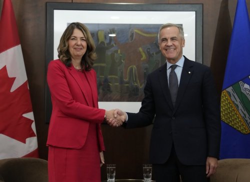 Prime Minister Mark Carney is seen with Alberta Premier Danielle Smith at the start of a meeting in Ottawa, Monday, Oct. 6, 2025. THE CANADIAN PRESS/Adrian Wyld