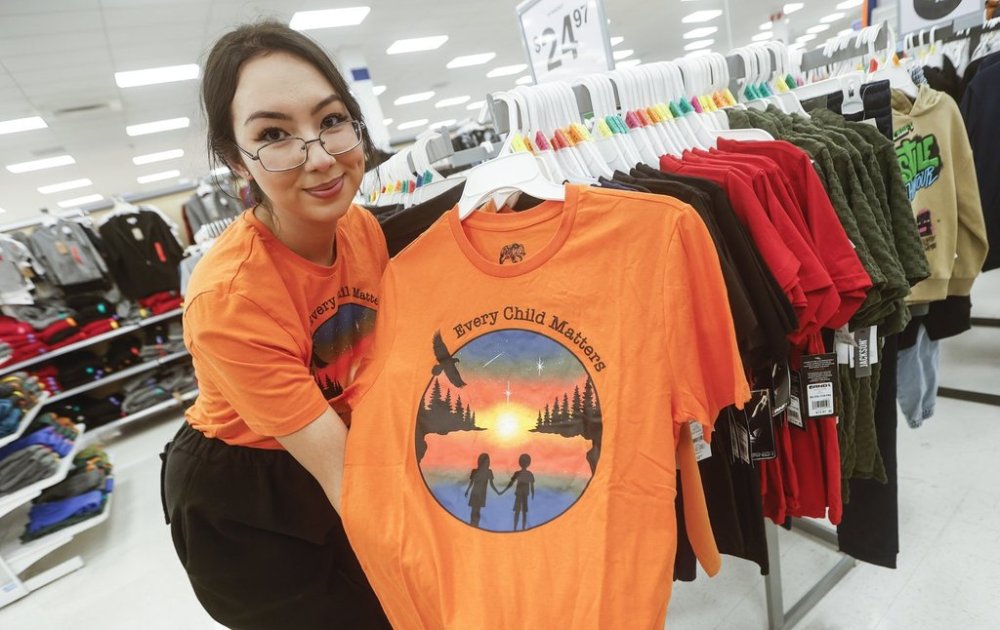 Brooklyn Rudolph, a Winnipeg designer who was selected by Walmart to create their Orange Shirt Day design, is photographed at a Walmart in Winnipeg, Man., Wednesday, Sept. 24, 2025. THE CANADIAN PRESS/John Woods