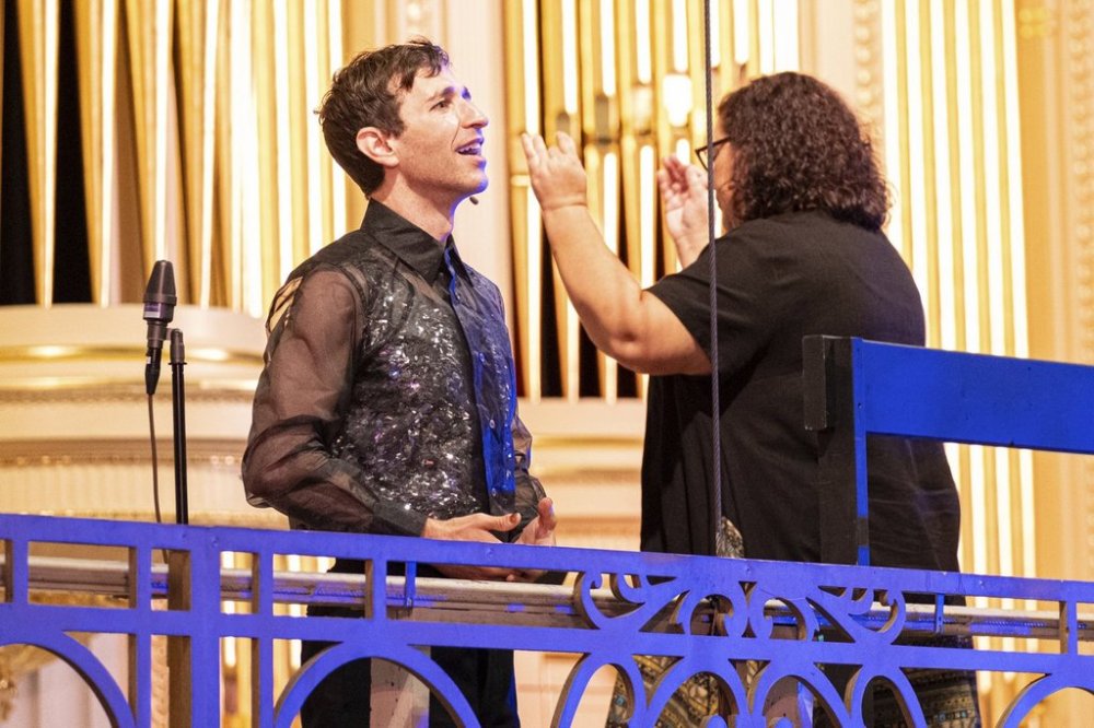 This image released by Opera Philadelphia shows Anthony Roth Costanzo, general director and president of Opera Philadelphia, left, singing an aria by Handel, left, as Elizabeth Braden conducts the orchestra and pipe organ, during an event on Sept. 7, 2025 in Philadelphia, to preview the company’s new season. (Ray Bailey/Opera Philadelphia via AP)