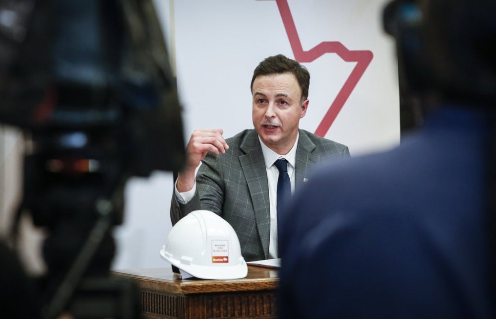 Manitoba Finance Minister Adrien Sala speaks to media at a press conference before the provincial budget is read at the Manitoba legislature in Winnipeg, Thursday, March 20, 2025. THE CANADIAN PRESS/John Woods