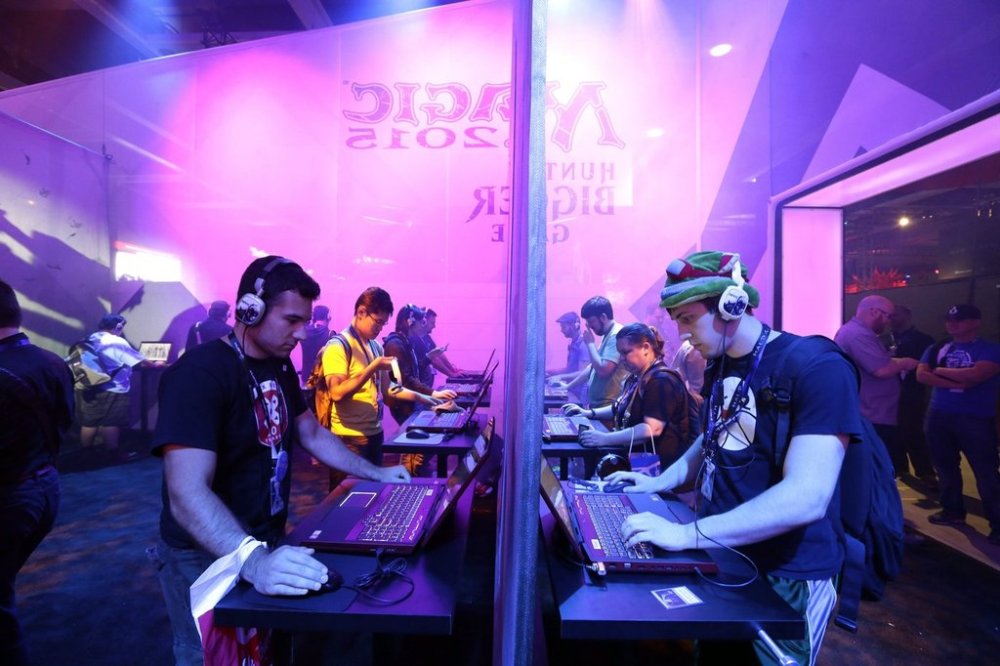 Wizards of the Coast is opening a new video game studio in Montreal, which will serve as a hub for productions from the Dungeons & Dragons franchise. A video game competition organized by Wizards of the Coast, Friday, Aug. 29, 2014. (AP Photo/Ted S. Warren, Archives)