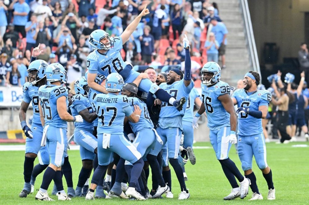 Toronto Argonauts kicker Lirim Hajrullahu (70) is hoisted by teammates after kicking the game-winning field goal against the Edmonton Elks during second half CFL football action in Toronto Saturday, Sept. 13, 2025. THE CANADIAN PRESS/Jon Blacker