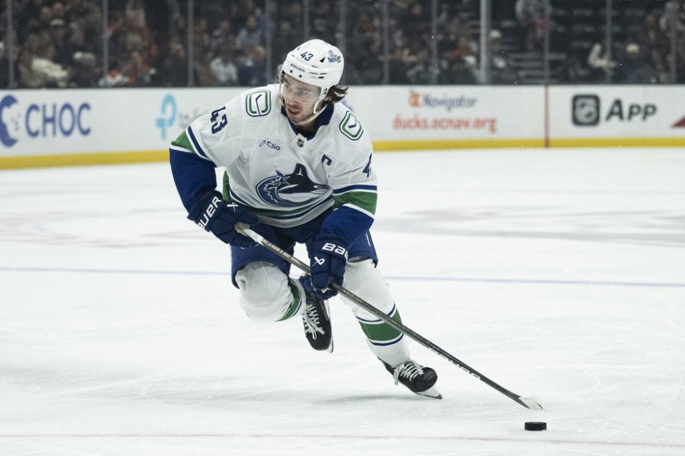 Vancouver Canucks defenseman Quinn Hughes (43) skates during an NHL hockey game against the Anaheim Ducks, Thursday, Feb. 27, 2025, in Anaheim, Calif. (AP Photo/Kyusung Gong)