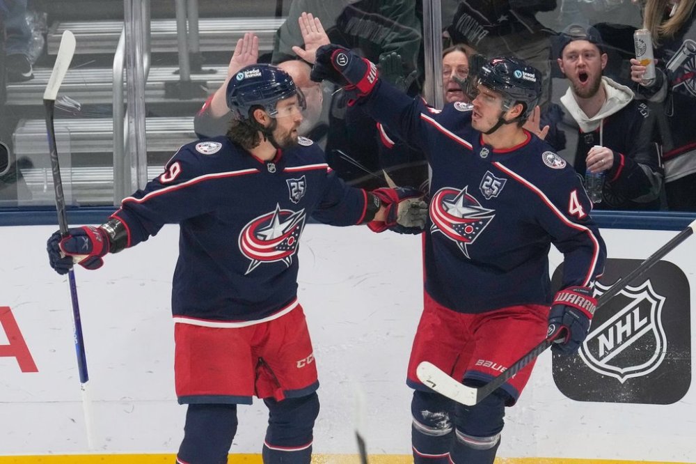 Columbus Blue Jackets center Cole Sillinger (4) celebrates his goal with defenseman Ivan Provorov (9) in the first period of an NHL hockey game against the Toronto Maple Leafs in Columbus, Wednesday, Oct. 29, 2025. (AP Photo/Sue Ogrocki)