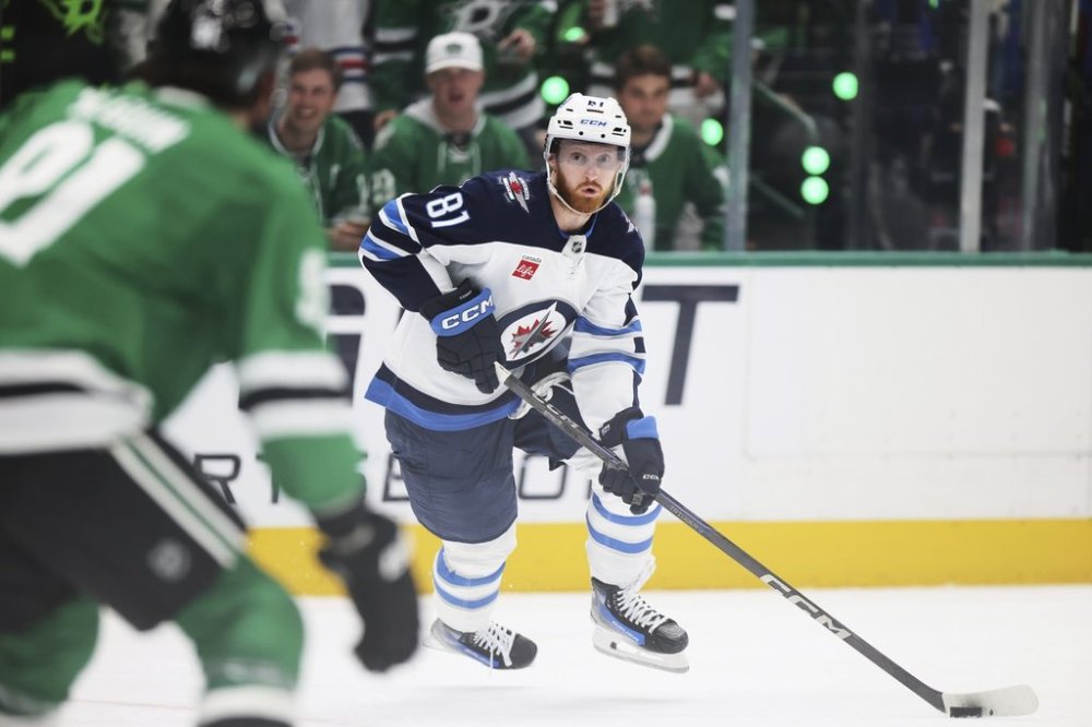 Winnipeg Jets left wing Kyle Connor (81) controls the puck in the second period of Game 6 of a second-round NHL hockey playoff series against the Dallas Stars in Dallas, Saturday, May 17, 2025. (AP Photo/Gareth Patterson)