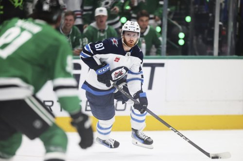 Winnipeg Jets left wing Kyle Connor (81) controls the puck in the second period of Game 6 of a second-round NHL hockey playoff series against the Dallas Stars in Dallas, Saturday, May 17, 2025. (AP Photo/Gareth Patterson)