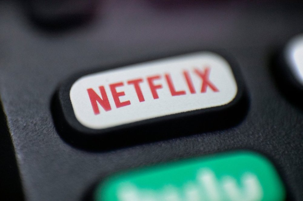 FILE - This Aug. 13, 2020 photo shows a logo for Netflix on a remote control in Portland, Ore. (AP Photo/Jenny Kane, File)