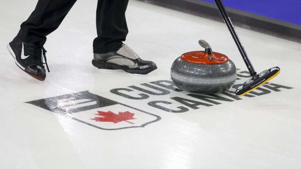 A curling stone passes over a logo during a practice session at the Tim Hortons Brier in Lethbridge, Alta., Friday, March 4, 2022. THE CANADIAN PRESS/Jeff McIntosh