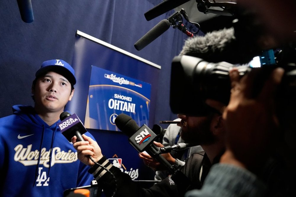 Los Angeles Dodgers star Shohei Ohtani speaks reporters in Toronto on Thursday, Oct. 23, 2025. (AP Photo/Brynn Anderson)