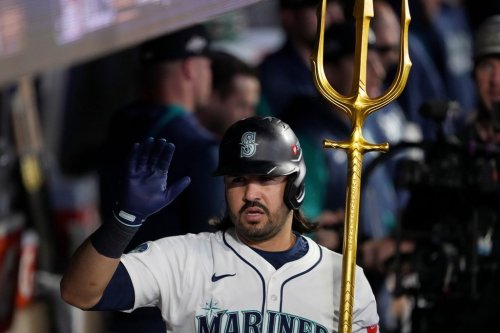 Seattle Mariners' Eugenio Suárez celebrates his solo home run during the second inning in Game 5 of baseball's American League Championship Series against the Toronto Blue Jays, Friday, Oct. 17, 2025, in Seattle. (AP Photo/Lindsey Wasson)