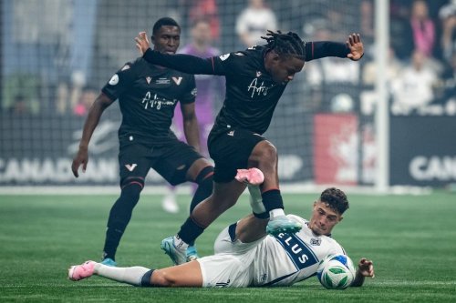 Vancouver FC's Thierno Bah (7) jumps over Vancouver Whitecaps' Sebastian Berhalter (16) during the first half of the Canadian Championship final soccer match, in Vancouver, on Wednesday, October 1, 2025. THE CANADIAN PRESS/Ethan Cairns