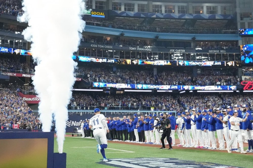 Blue Jays infielder Bo Bichette (11) takes the field during player introductions ahead of Game 1 of the World Series against the Los Angeles Dodgers in Toronto on Oct. 24, 2025. THE CANADIAN PRESS/Nathan Denette