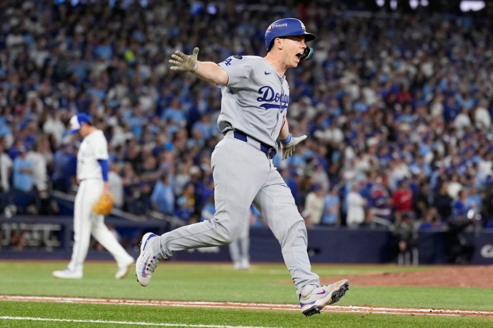 Los Angeles Dodgers' Will Smith celebrates a home run against the Toronto Blue Jays during the11th inning in Game 7 of baseball's World Series, Sunday, Nov. 2, 2025, in Toronto. (AP Photo/Brynn Anderson)