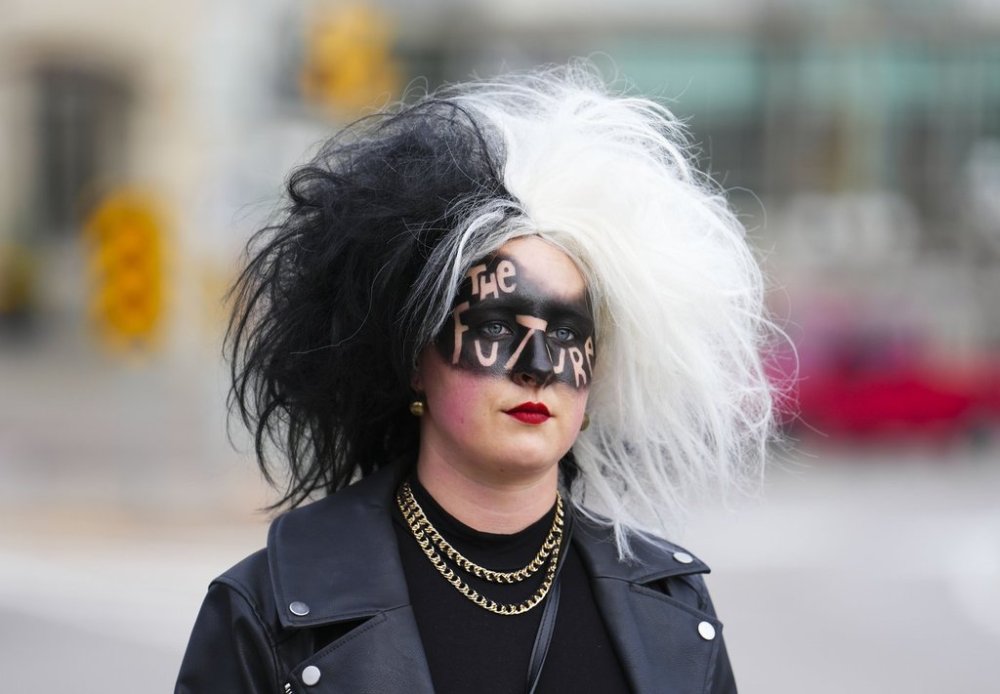 A person dressed for Halloween makes their way through downtown Ottawa, on Monday, Oct. 31, 2022. THE CANADIAN PRESS/Sean Kilpatrick
