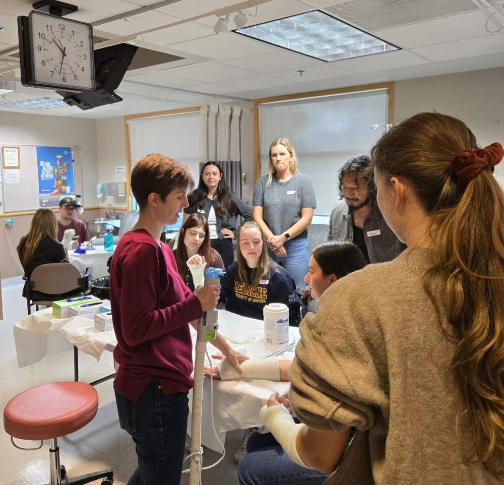 Dr. Leah Koetting (in red sweater), a family physician at the Swan Valley Primary Care Centre, is seen explaining the proper casting procedures to first- and second-year medical students from the University of Manitoba's Max Rady College of Medicine. (Prairie Mountain Health)
