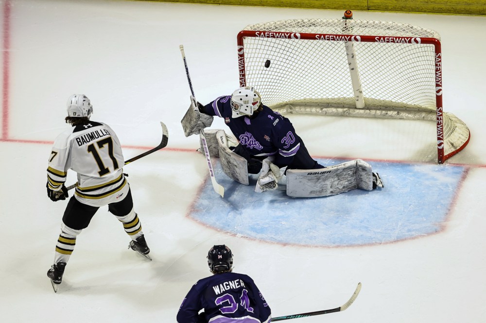 Brandon Wheat Kings forward Joby Baumuller (17) backhands the puck past Regina Pats goalie Taylor Tabashniuk (30) as defenceman Aiden Wagner (34) looks on during Western Hockey League action at Brandt Centre on Saturday. Regina won 6-4. (Keith Hershmiller Photography)
Oct. 18, 2025