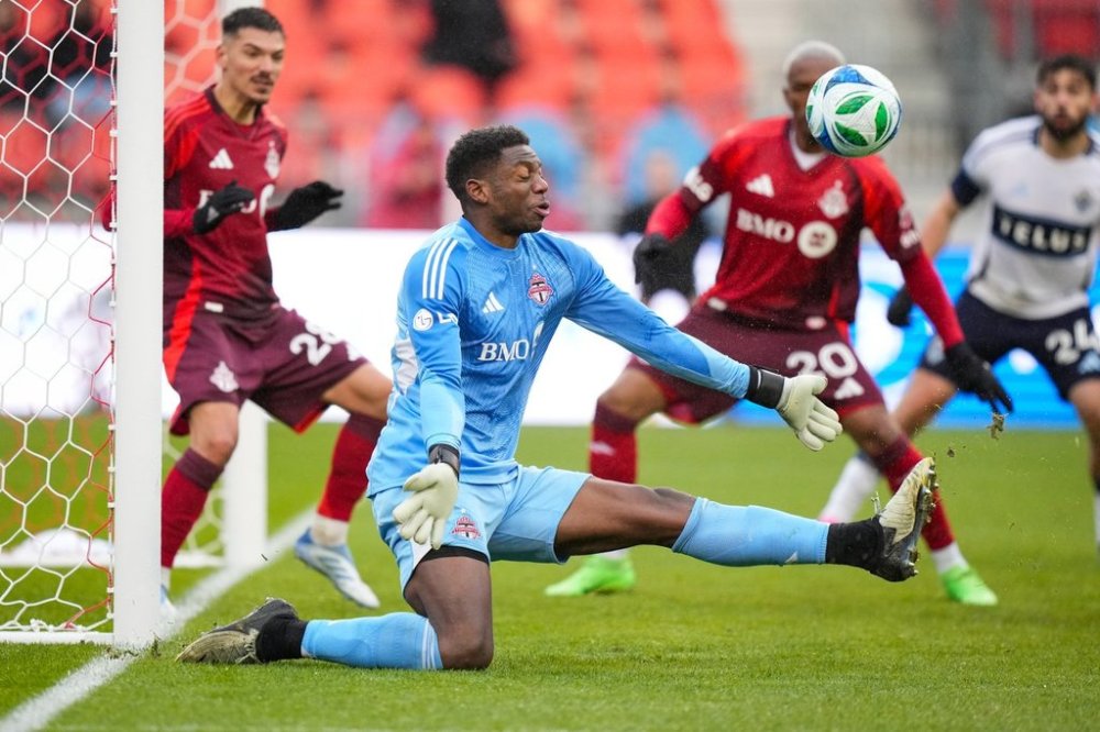 Toronto FC goalkeeper Sean Johnson (1) moves to block a shot during second half MLS soccer action against the Vancouver Whitecaps, in Toronto on Saturday, March 29, 2025. THE CANADIAN PRESS/Arlyn McAdorey