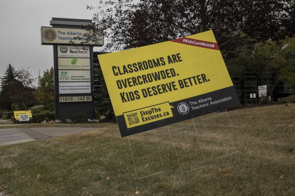 Protest signs outside the Alberta Teachers' Association in Edmonton on Monday Oct. 6, 2025. THE CANADIAN PRESS/Amber Bracken